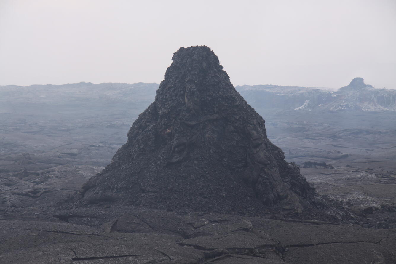 The spatter cone near the north rim of Pu‘u ‘Ō‘ō crater continues t...