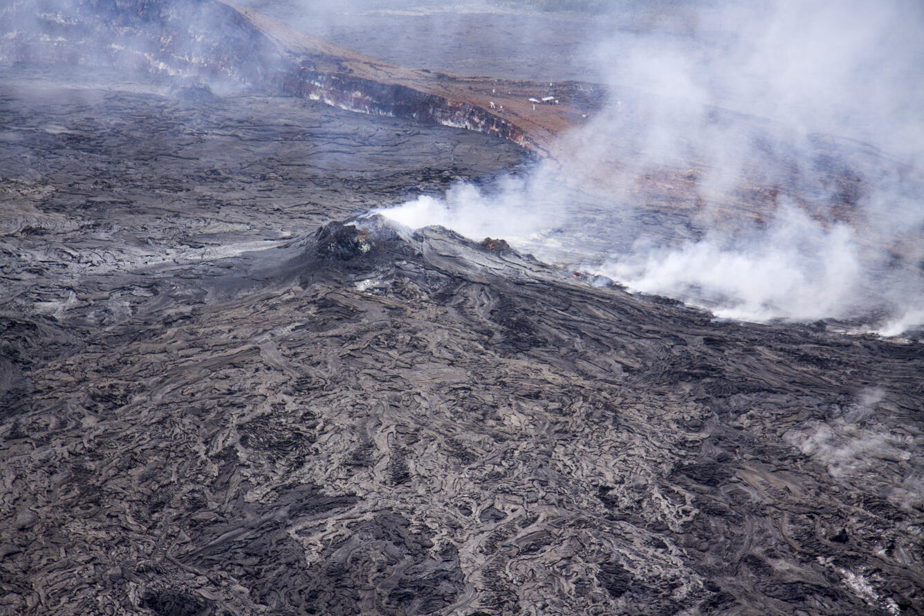 Incandescent skylights adorn the spatter cone and the lava tube in ...