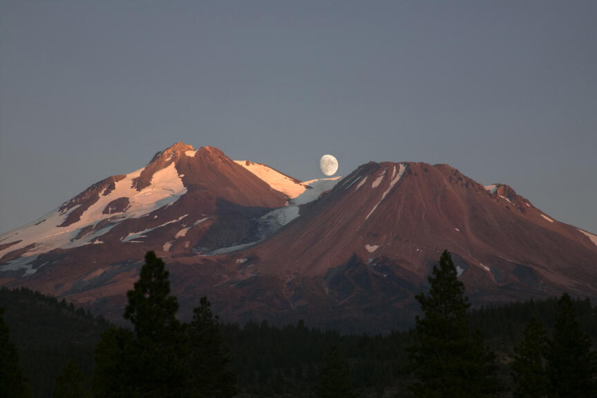 Mount Shasta and Shastina viewed toward the west at sunset....