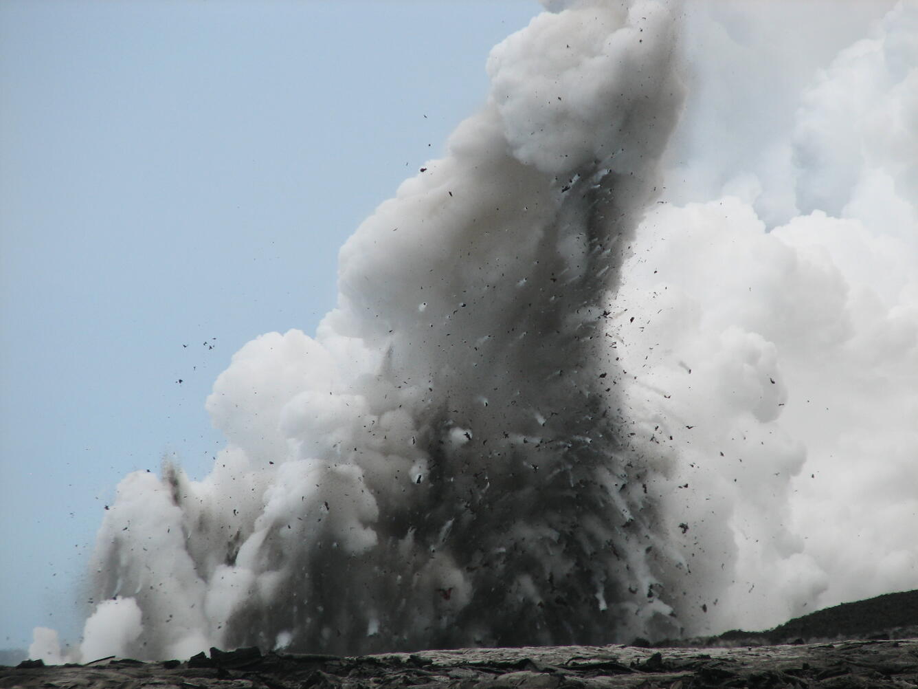 Tephra-jet explosion hurls spatter onto active lava delta on the so...