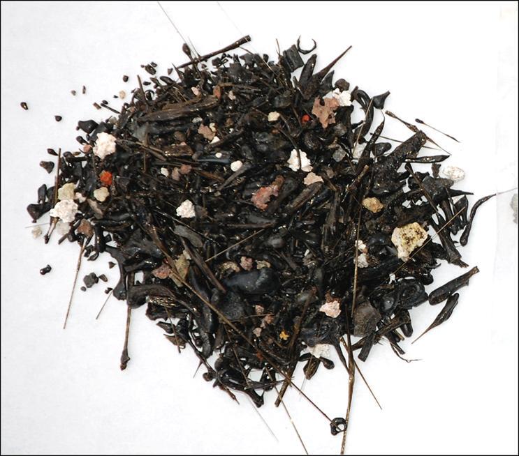 Tephra, including rock fragments, tiny spheres, and shards of volca...