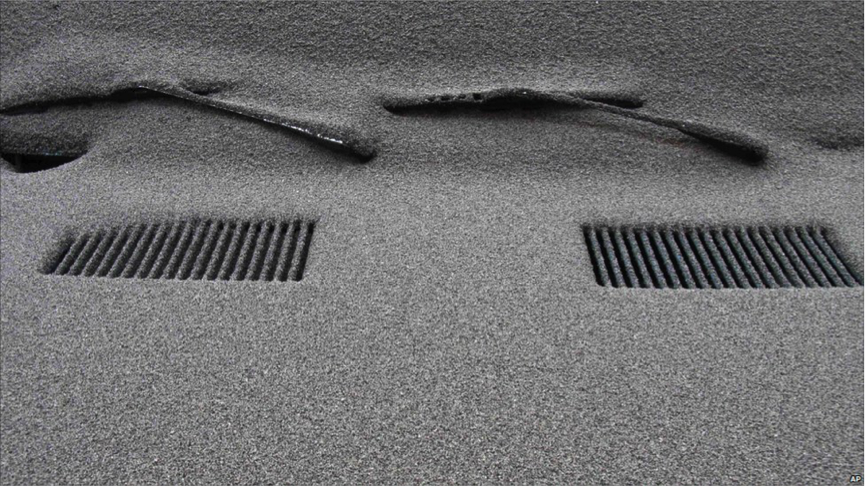 Ash blanket cover a car following the Puyehue eruption, Chile, 2011...