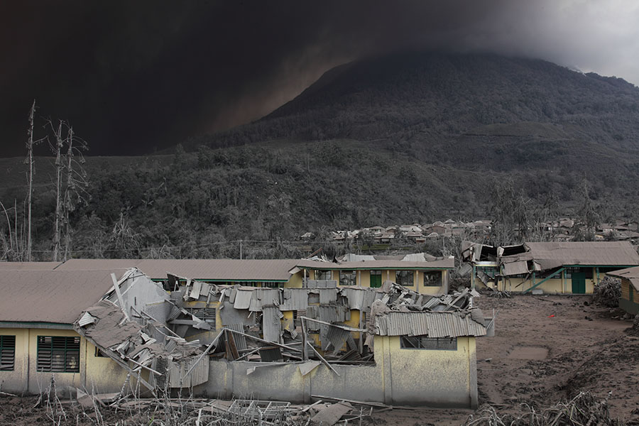 Partial roof collapse from Sinabung eruption...