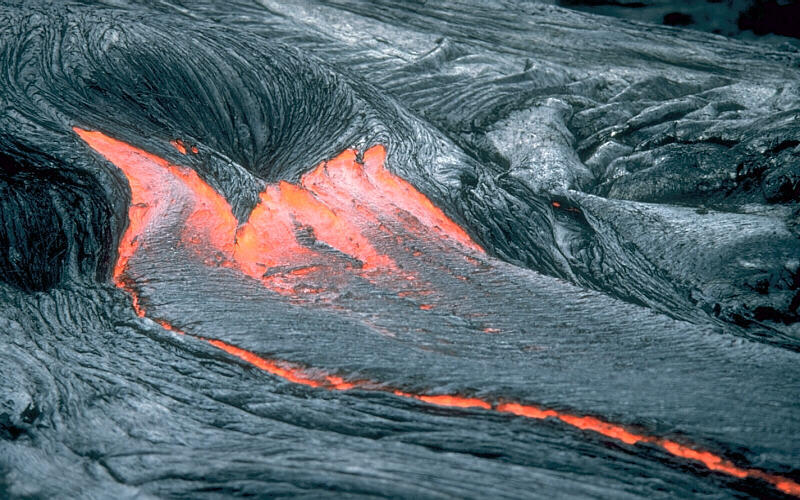 Lava moves across the ground as a pahoehoe flow, Kīlauea Volcano, H...