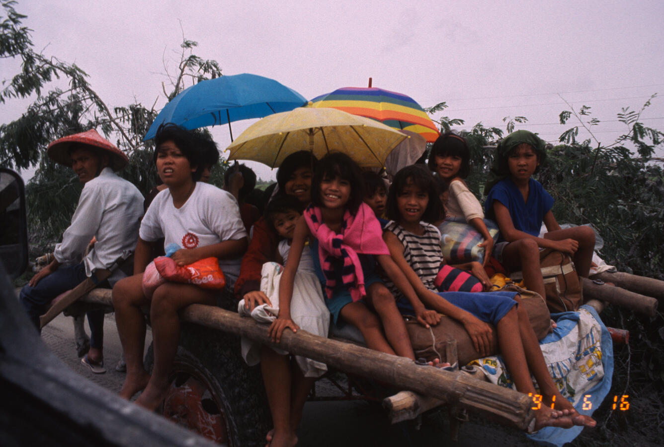 Evacuees seek refuge from June 15, 1991 eruption of Mount Pinatubo,...