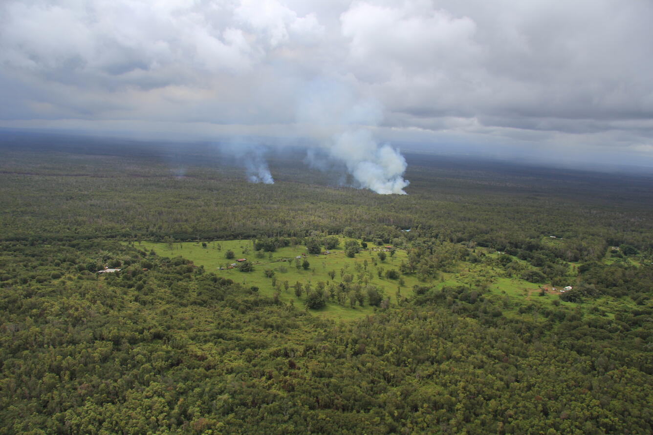 Smoke plumes indicate the location of the June 27th lava flow, whic...