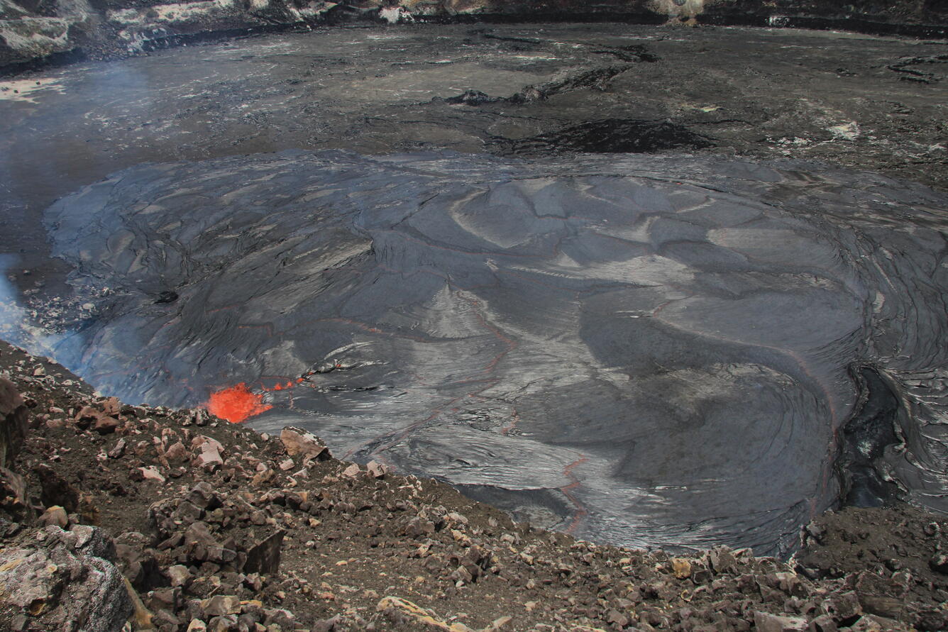 Summit lava lake overflows vent rim...