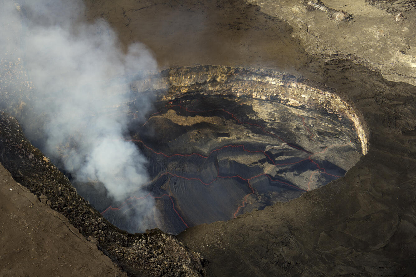 A closer view of the lava lake surface. The white plume originates...