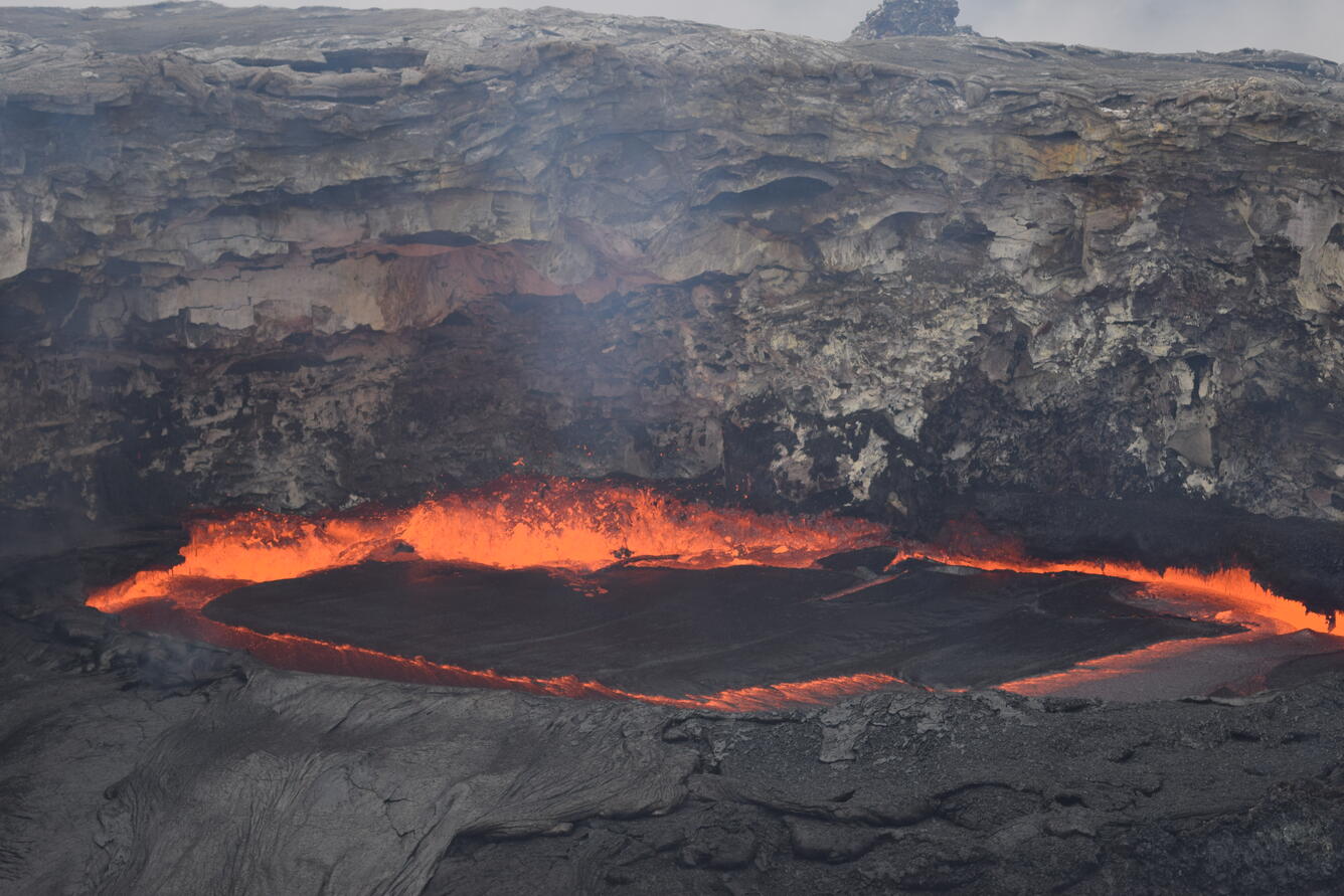 A closer look at the spattering and agitation in the small lava pon...