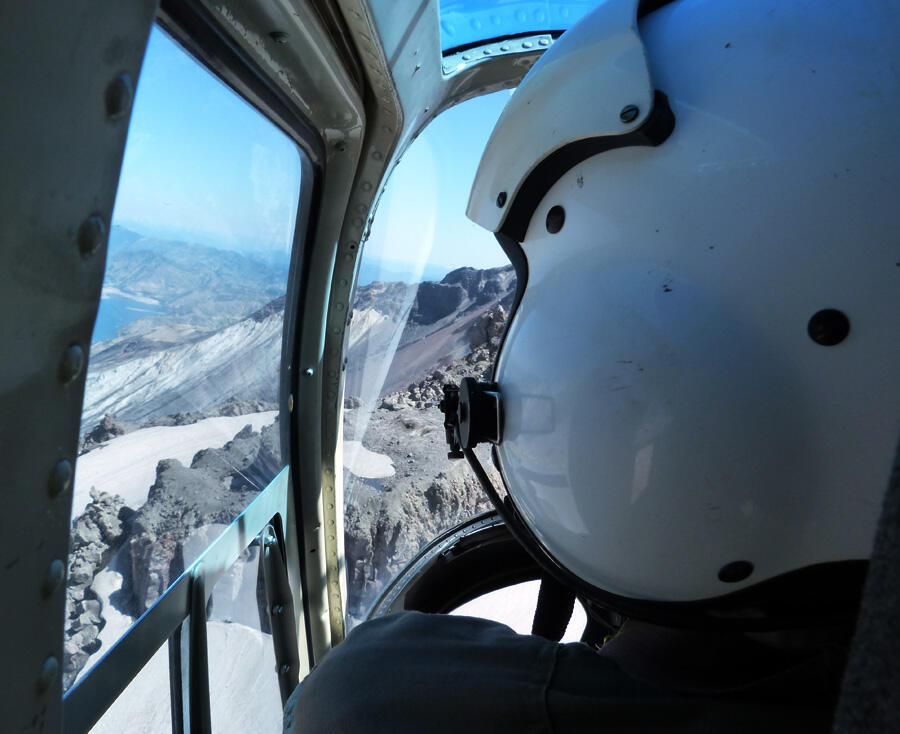 Observing changes in the new dome from helicopter, which provides s...