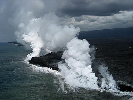 Who owns new coastal lands created by lava flows?...