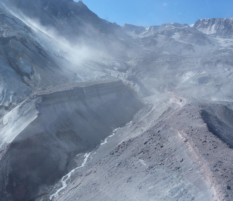Rocks cascade from the eastern rim (hazy area upper left of image) ...