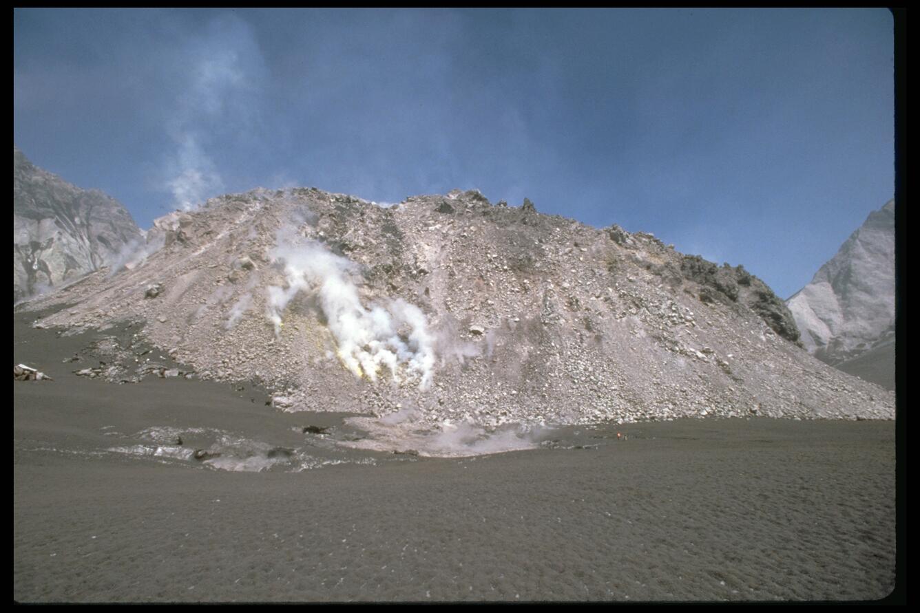 Dome in Mount St. Helens crater; two USGS geologists (one in orange...