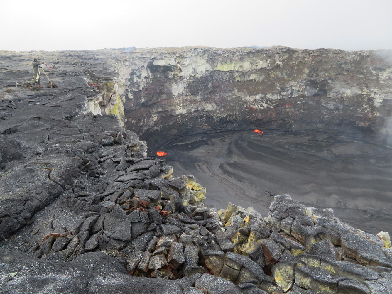 HVO geologists relocate a time-lapse camera on the rim of the west ...