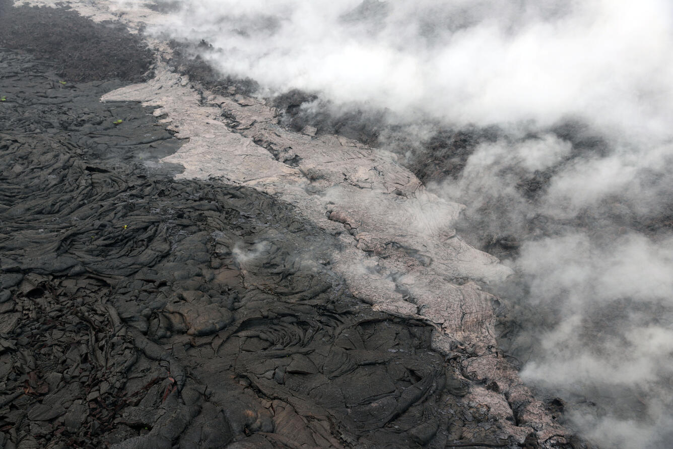 Telephoto view of a small lava flow (lighter in color) and spatter ...