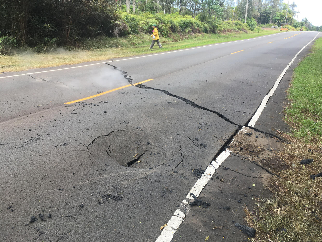 At 12:26 p.m. HST. Crack in Pohoiki Road just east of Leilani Stree...