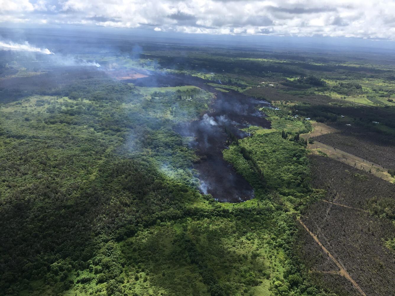 At 3:24 p.m. HST, the flow front of Fissure 17 continues down slope...