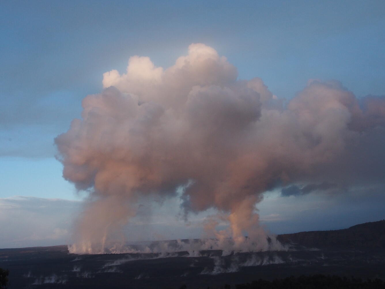 At 6AM HST, sunrise highlights twin pillars of rising gases that me...