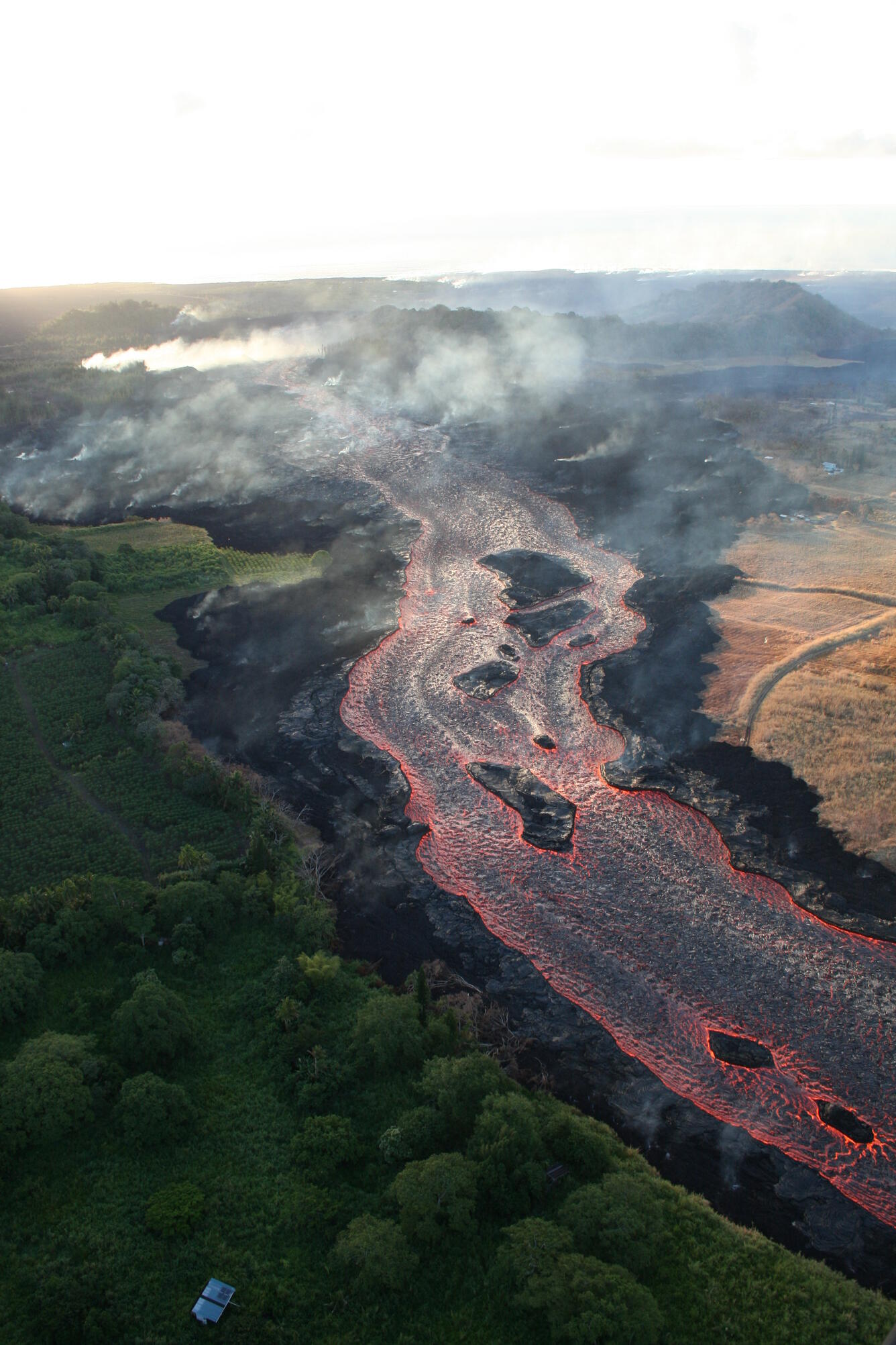 Lava from fissure 8 travels about 13 km (8 mi) to the ocean entry. ...