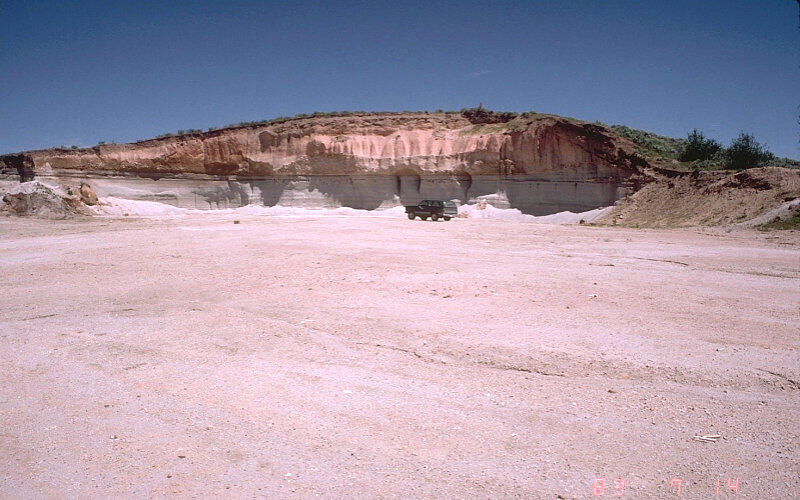 Mesa Falls ash-flow tuff and underlying fallout ash exposed in a qu...