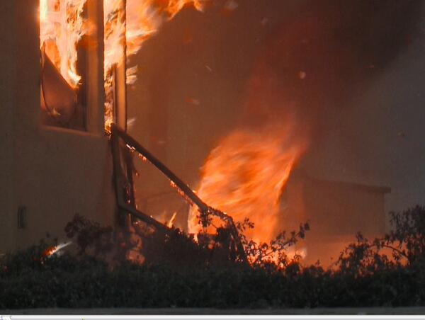 Image: A Fire Tornado Swirls Near a Home in Southern California