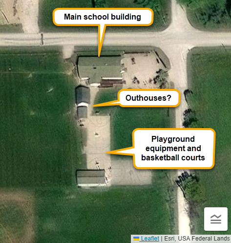 Aerial imagery of the Green Acres Amish School showing school building, possible outhouses, and playground features.