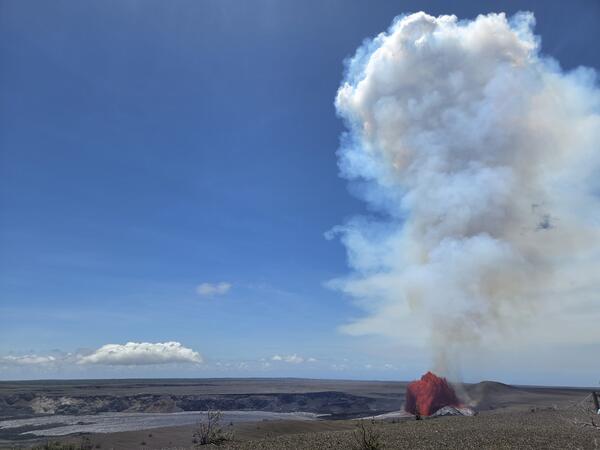 Color photograph of lava fountain within caldera