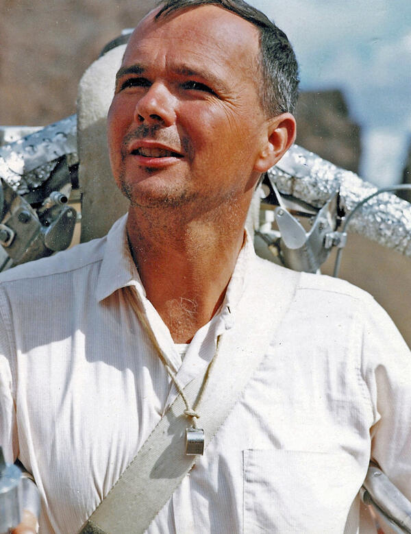 Closeup of Gene Shoemaker smiling while wearing a prototype rocket jetpack in Hopi Buttes, AZ in 1966.