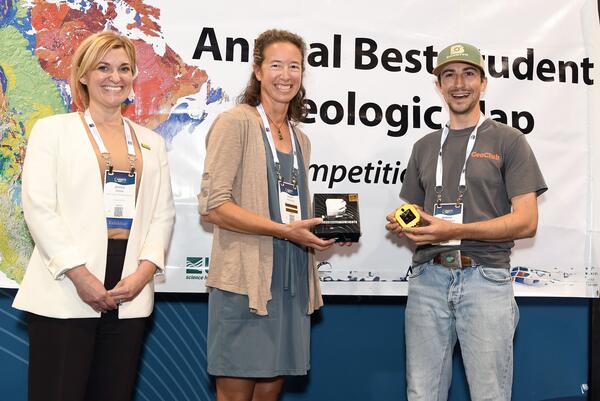  AASG President Jessica Moore and Brunton CEO Lauren Heerschap present BSGMC winner Andrew Yokel-Deliduka with the 1st place prize