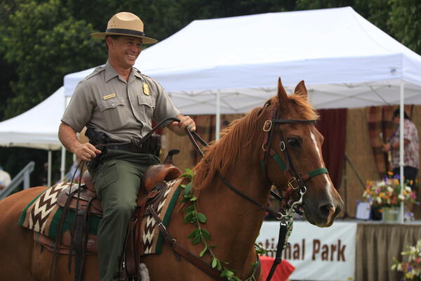Color photograph of National Park Ranger on a horse