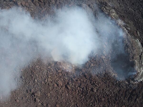 Color photograph of volcanic vent degassing