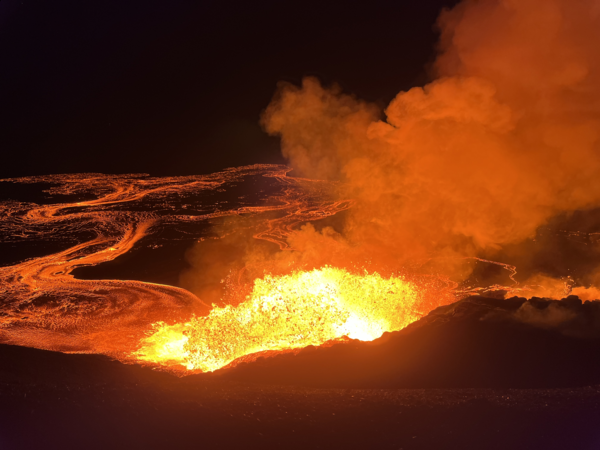 Color photograph of lava fountain at night