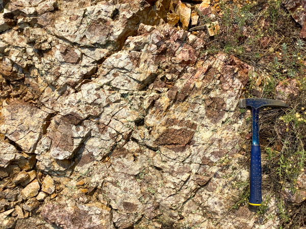rock outcrop with hammer