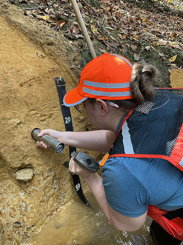 A USGS collects river samples for geologic analysis on Fountain Creek in Emporia, Virginia