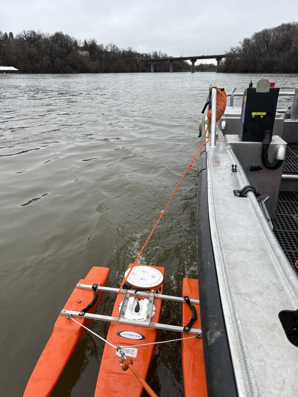 Acoustic Doppler current profiler measures flow off of the side of a boat