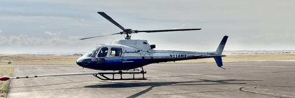blue and white helicopter (N114MX) that will be used for the Earth MRI survey over eastern Oregon