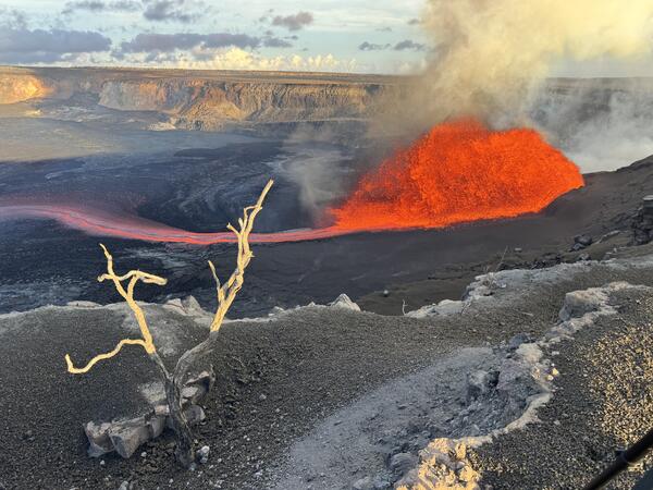 Color photograph of lava fountain and flow