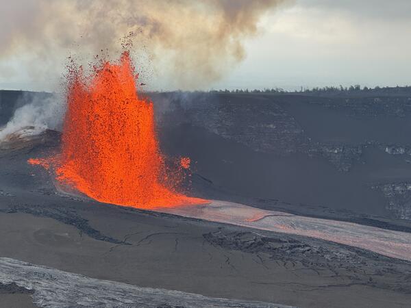 Color photograph of lava fountain and lava channel