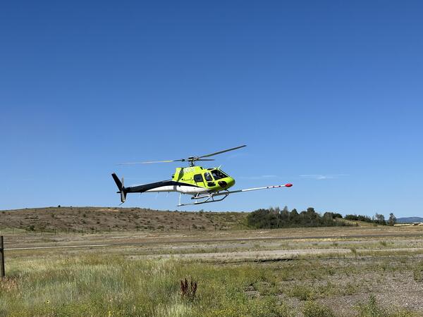 lime green, black, and white helicopter (N966FS)