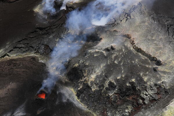 Color photograph of volcanic vent degassing