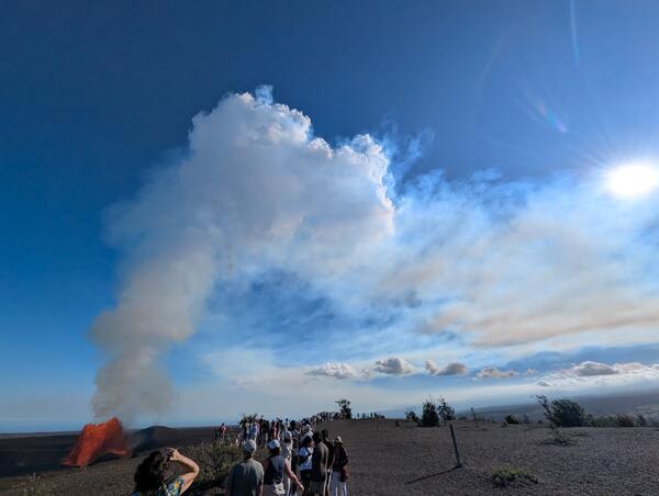 Visitors watch lava fountain at national park viewing area
