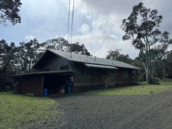Color photograph of tephra on a house