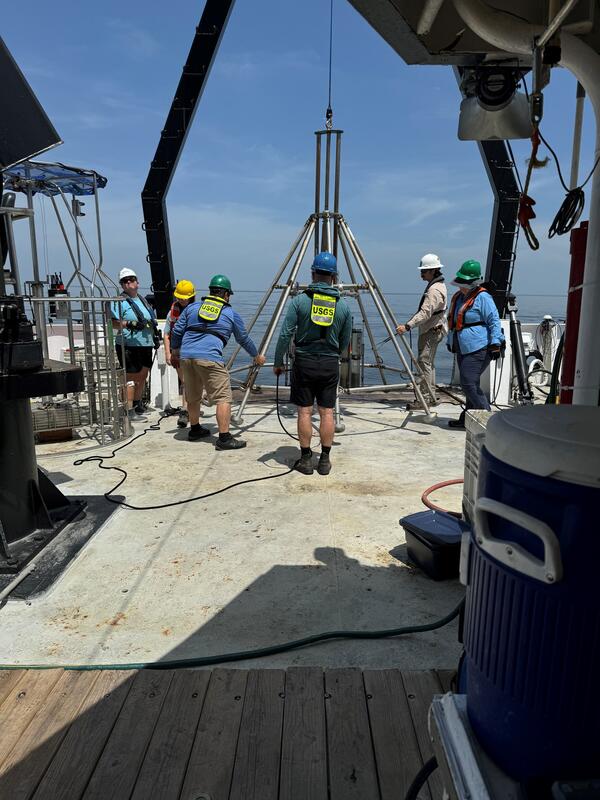 People on deck of ship working with mega multicorer