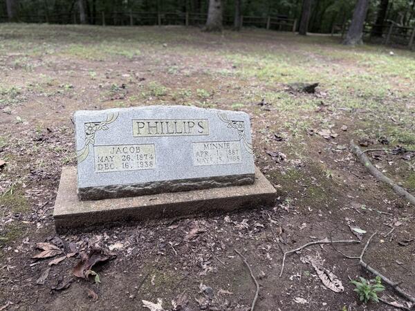 Phillips family headstone for Jacob and Minnie in a forest cemetery