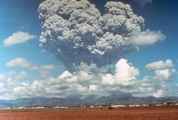 Massive gray cloud erupting from a volcano