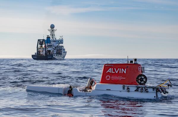 An image of a human-occupied vehicle as it submerges below the sea surface