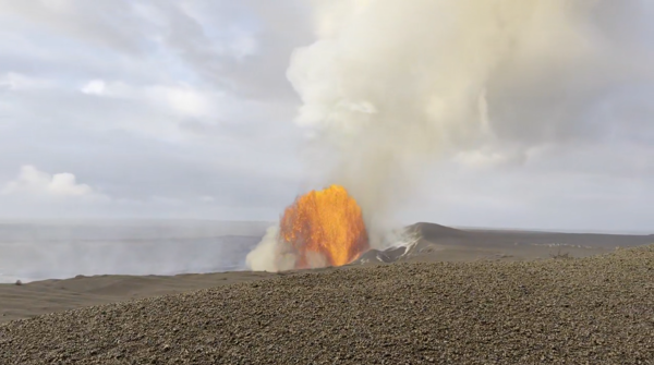 Color photograph of lava fountain within crater