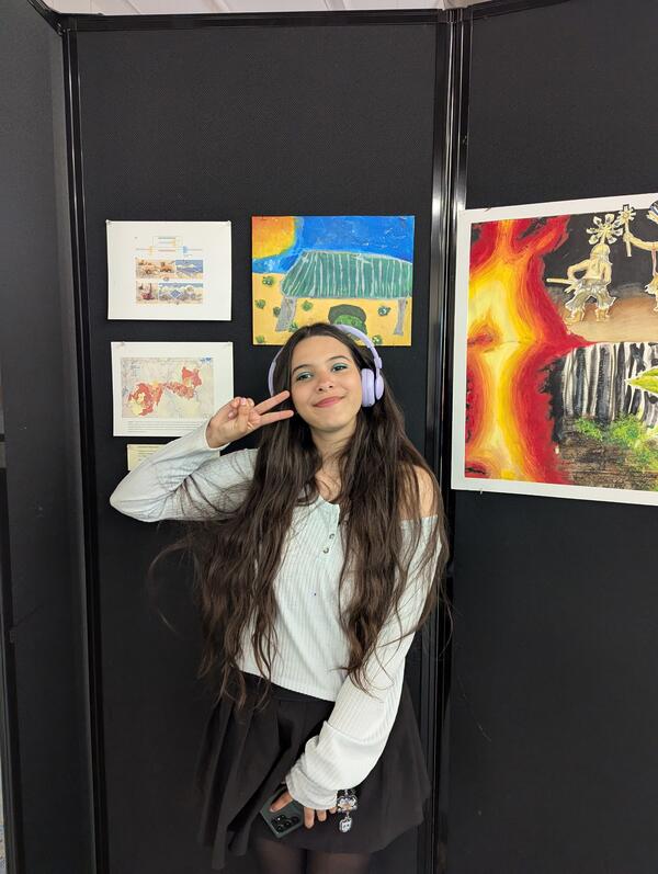 Sophia, FALA, with her artwork of solar panels in the Mojave desert based on a semester long collaboration with USGS scientist Dr. Claire Karban as seen at the Sept 2025 Art of Inquiry show at the USGS Flagstaff Science Campus.