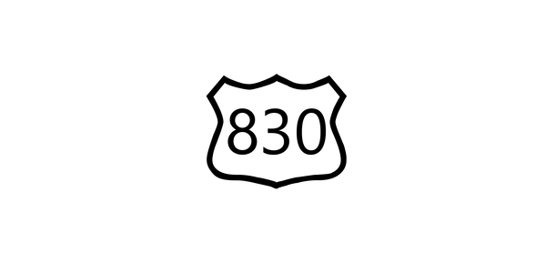 Text symbol with route number placed on top of a road shield marker.
