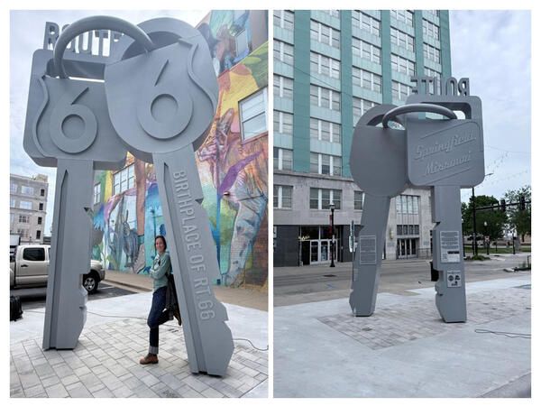 Large gray metal sculpture shaped like oversized keys marking the birthplace of Route 66